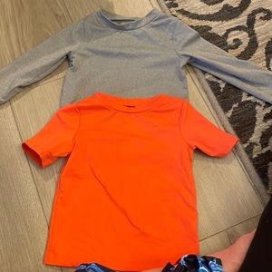 Long sleeve gray and short sleeve orange rash guard.